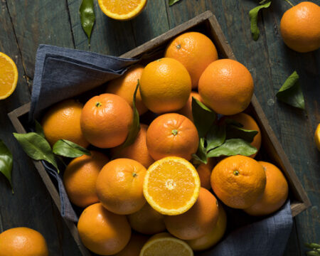 Raw Organic Orange Oranges in a Basket