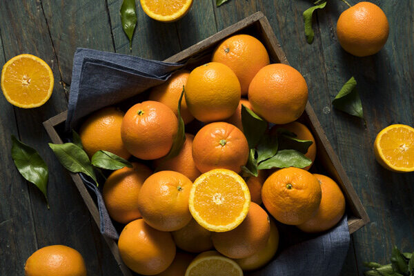Raw Organic Orange Oranges in a Basket