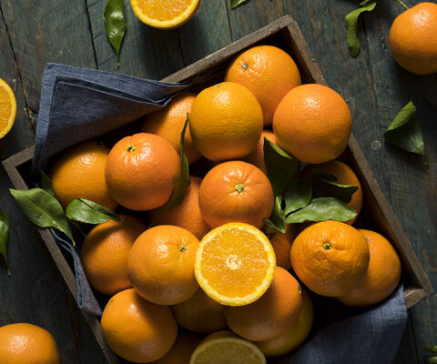 Raw Organic Orange Oranges in a Basket